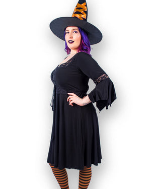 Model in Dare to Wear Sorceress Witch Costume with Black Renaissance Dress, Orange